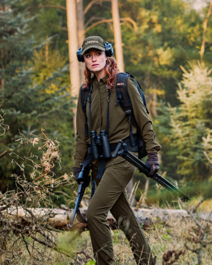 Willow Green Coloured Harkila Womens Herlet Tech Shirt on forest background 