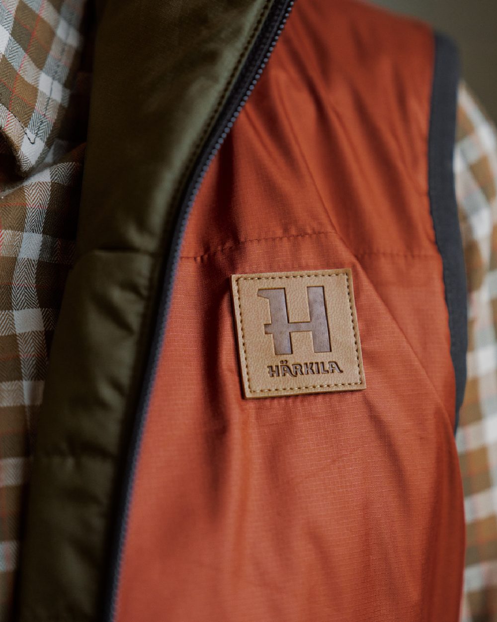 Willow Green Arabian Spice Coloured Harkila Womens Kalix HSP Waistcoat on blurry background 