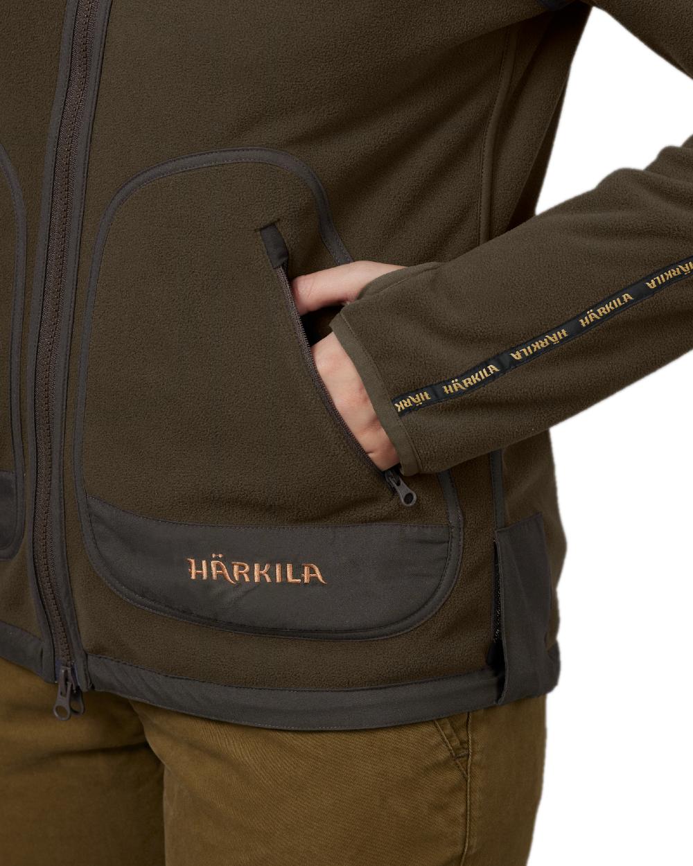 Brown Red Coloured Harkila Womens Kamko Reversible Windstopper Fleece Jacket on white background 