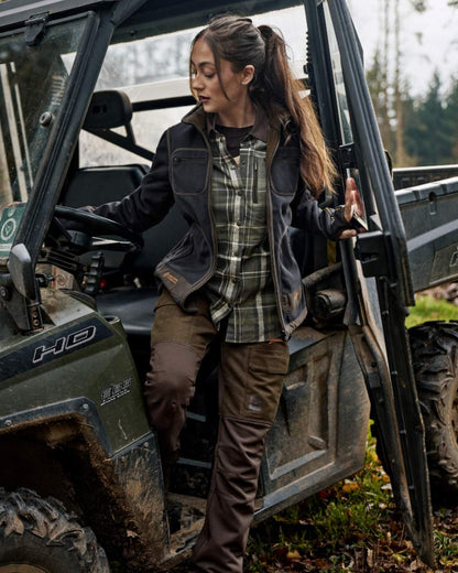 Willow Green Deep Well Purple Coloured Harkila Womens Kamko Reversible Windstopper Fleece Jacket on forest background 