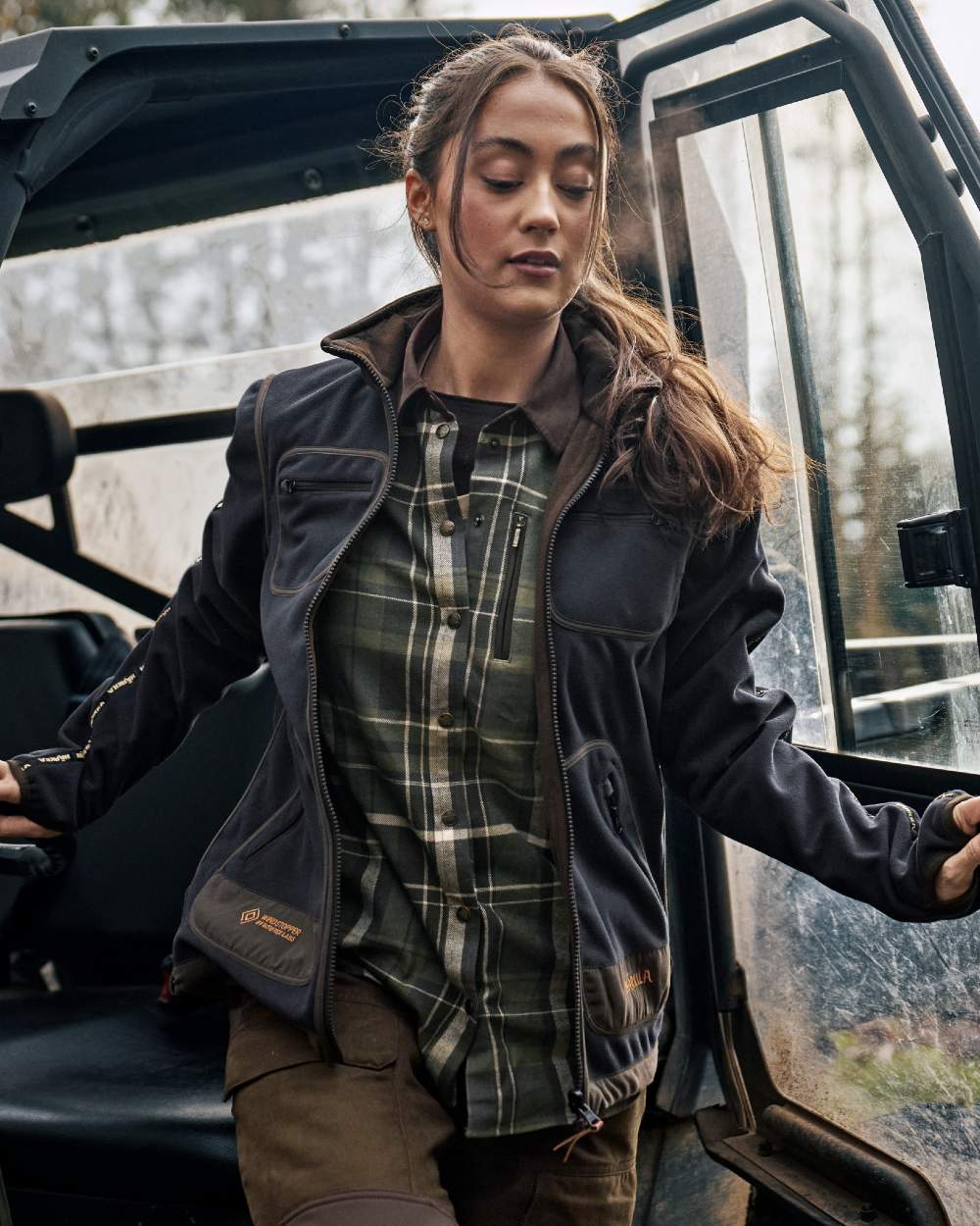 Willow Green Deep Well Purple Coloured Harkila Womens Kamko Reversible Windstopper Fleece Jacket on forest background 