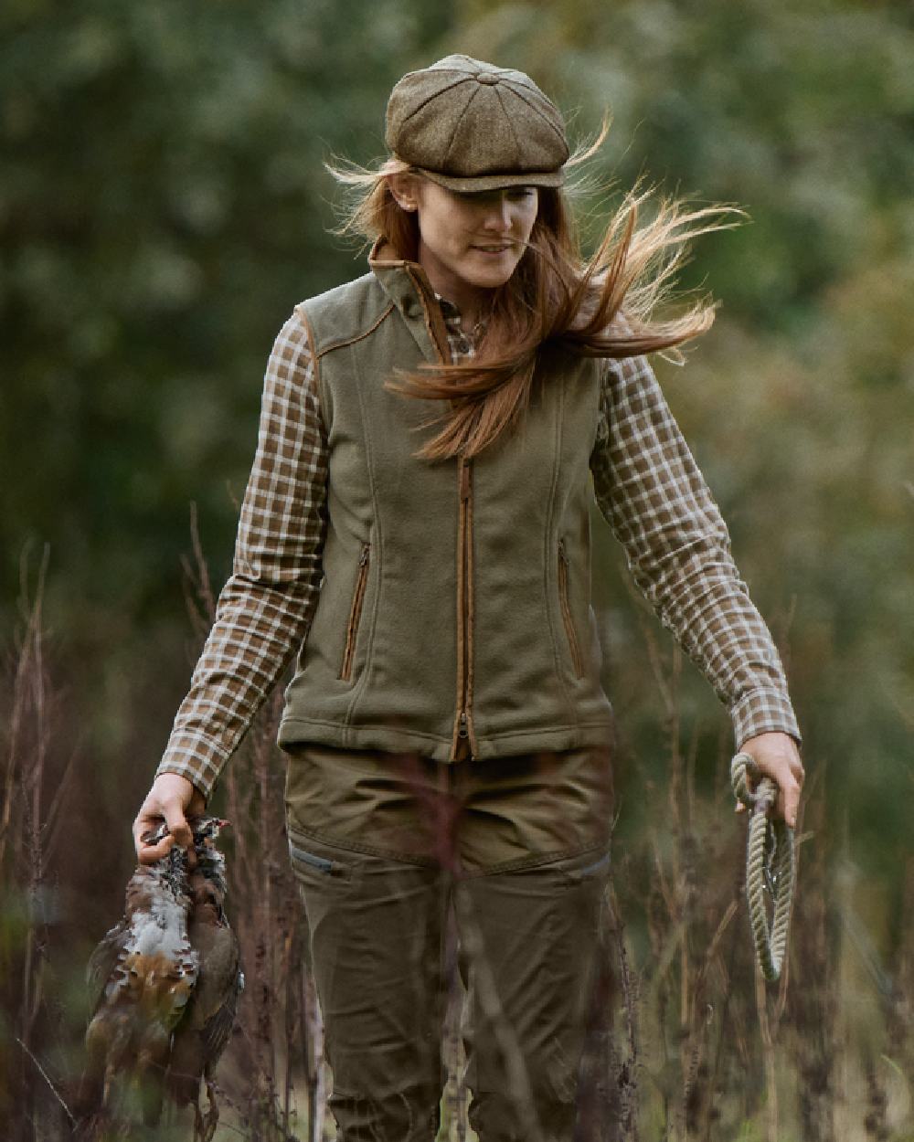 Grape Leaf Coloured Harkila Womens Sandhem 200 Fleece Waistcoat on outdoor background 