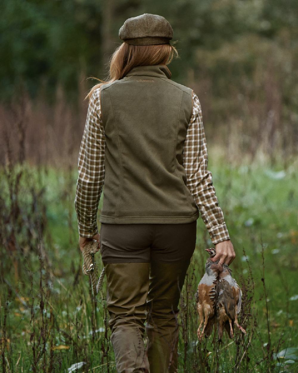 Grape Leaf Coloured Harkila Womens Sandhem 200 Fleece Waistcoat on outdoor background 