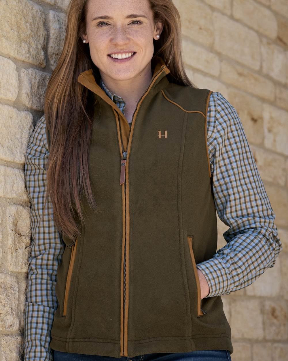 Willow Green Coloured Harkila Womens Sandhem 200 Fleece Waistcoat on outdoor background 