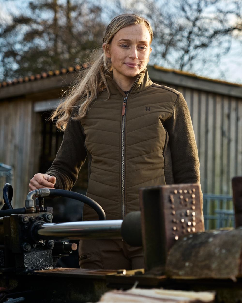 Willow Green Coloured Harkila Womens Sandhem Pro Insulated Cardigan on countryside background 