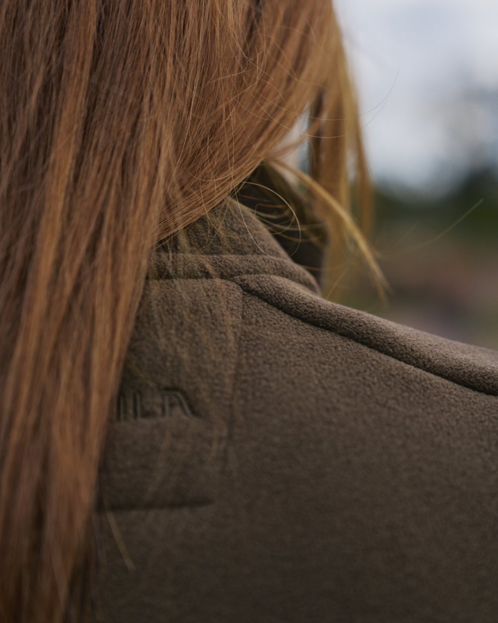 Demitasse Brown Coloured Harkila Womens Sandhem Sherpa Fleece Jacket on outdoor background 