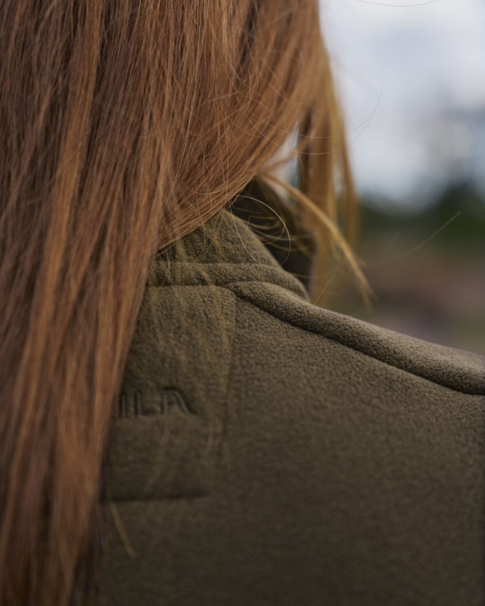 Willow Green Coloured Harkila Womens Sandhem Sherpa Fleece Jacket on outdoor background 