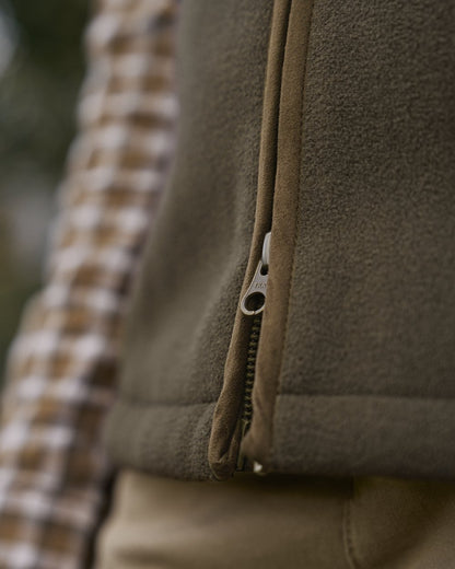 Willow Green Coloured Harkila Womens Sandhem Sherpa Fleece Waistcoat on outdoor background 