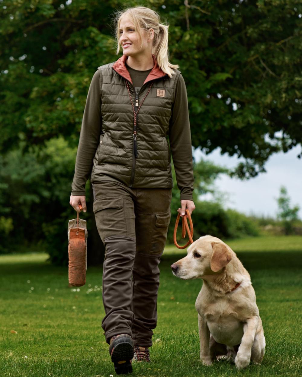 Willow Green Deep Brown coloured Harkila Womens Scandinavian Trousers on forest background 