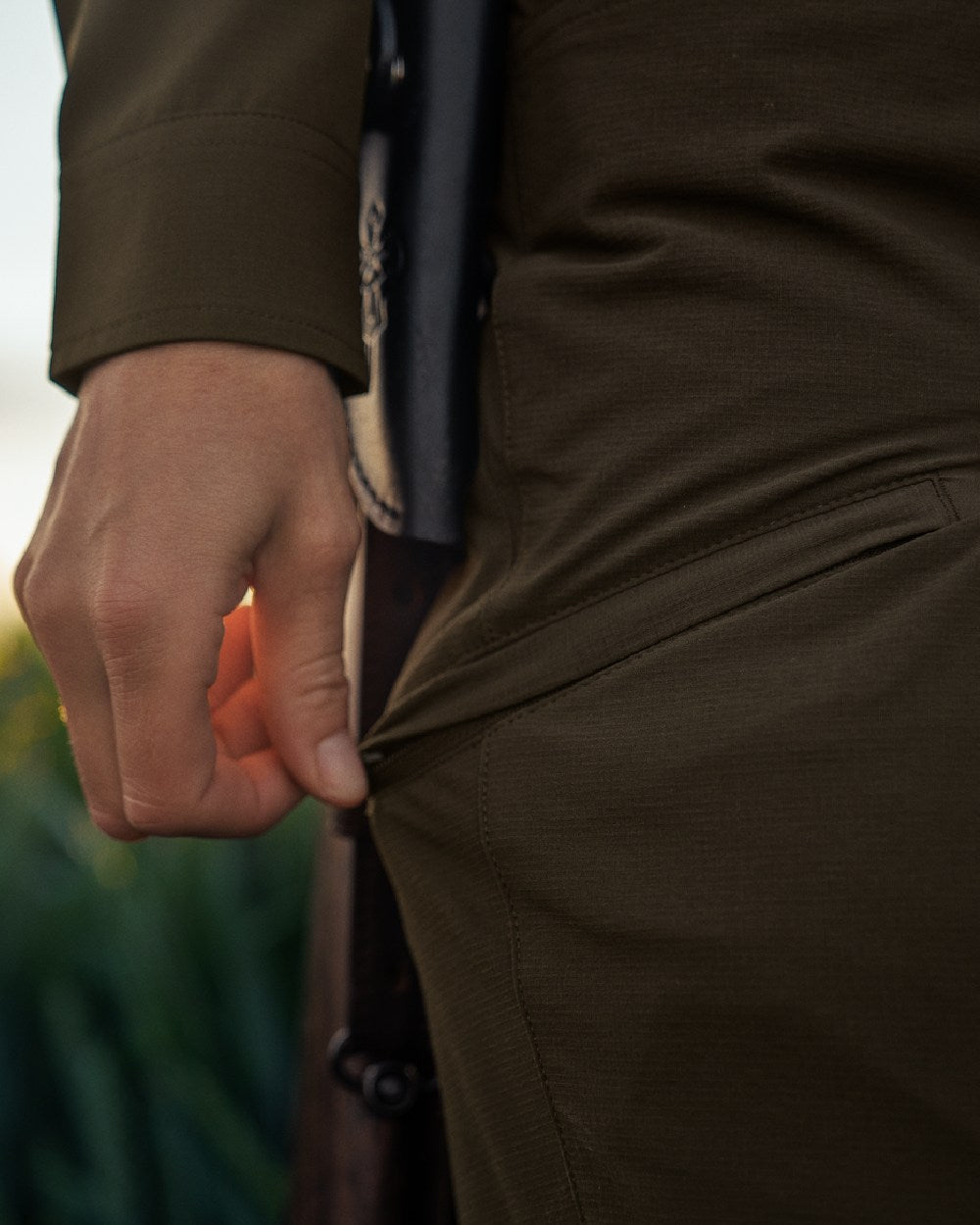 Willow Green Coloured Harkila Womens Trail Trousers on outdoor background 