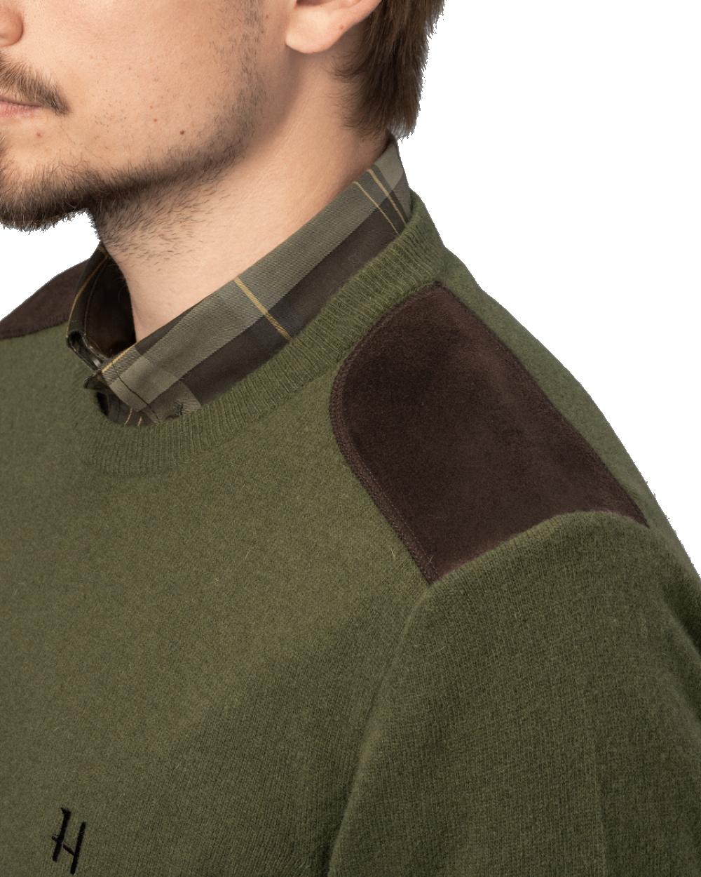 Olive coloured Harkila Arran Pullover on white background 