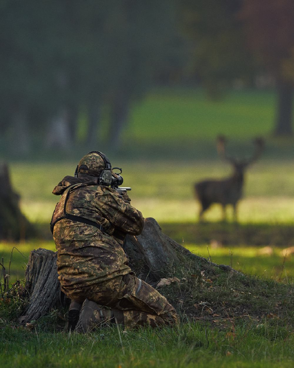 AXIS Forest coloured Harkila Deer Stalker Camo HWS Jacket worn by concealed hunter