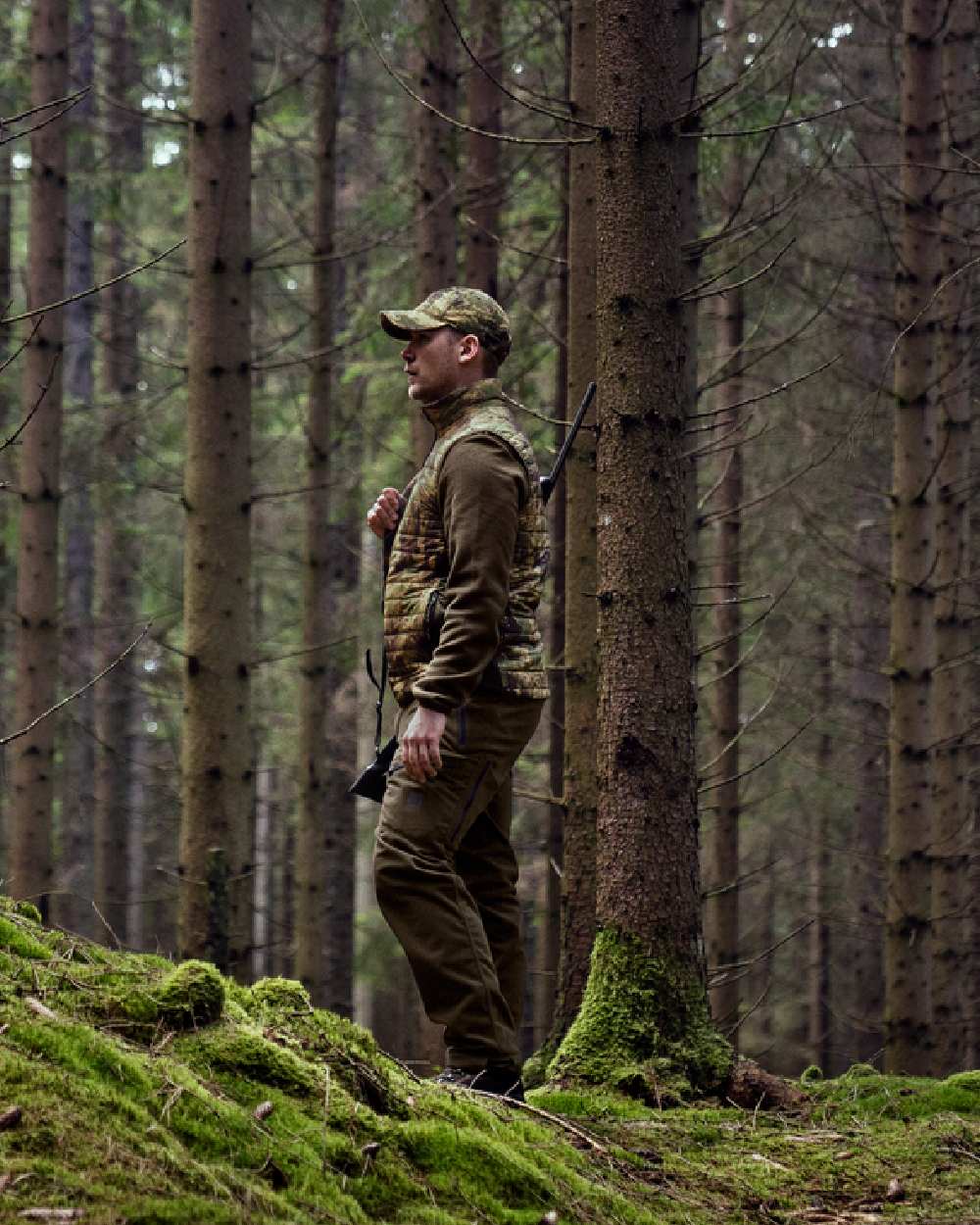 Axis Forest coloured Harkila Deer Stalker Camo Reversible Packable Waistcoat worn by hunter in woodland