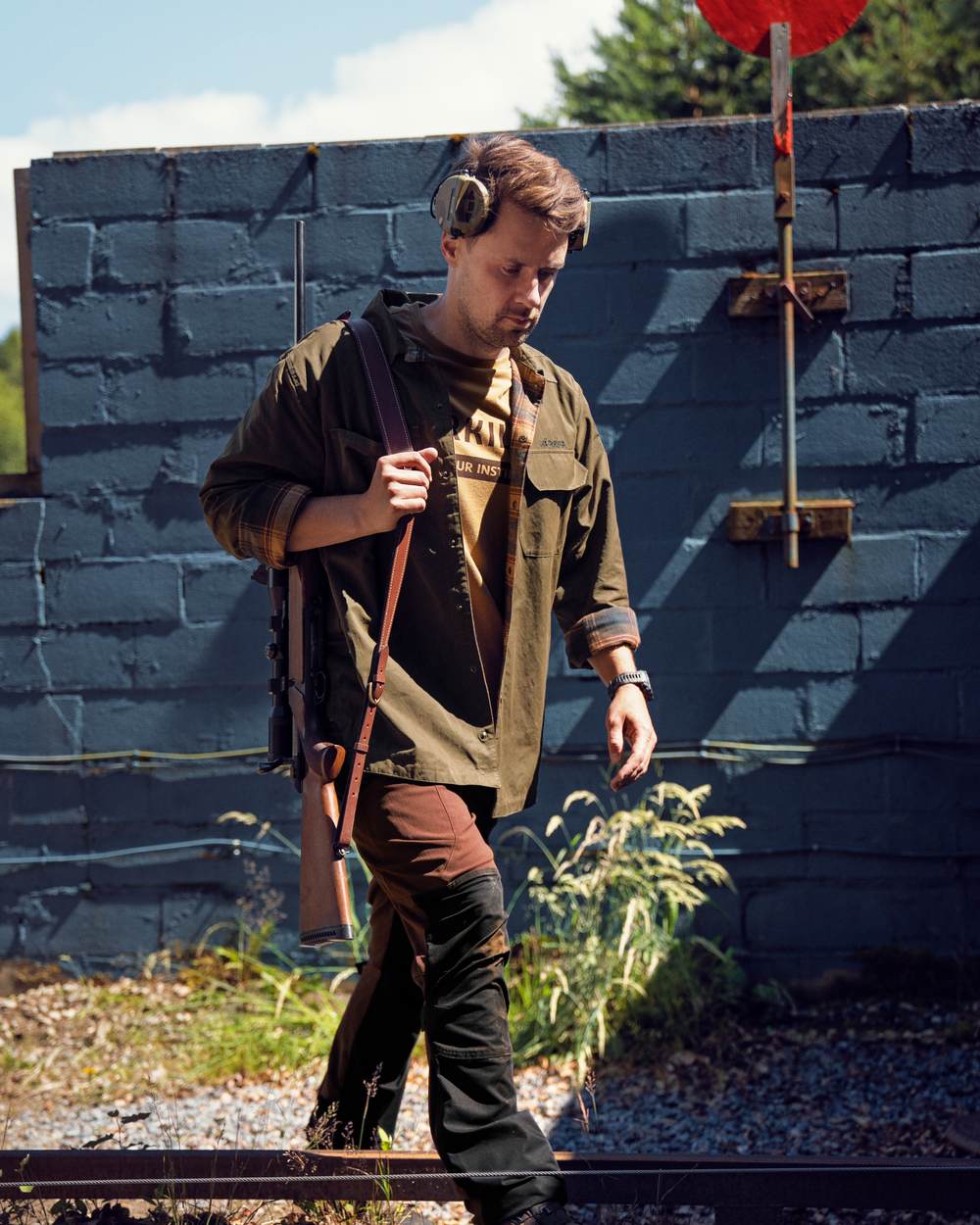 Dark Warm Olive/Burgundy coloured Harkila Eirik Reversible Shirt Jacket on hunter