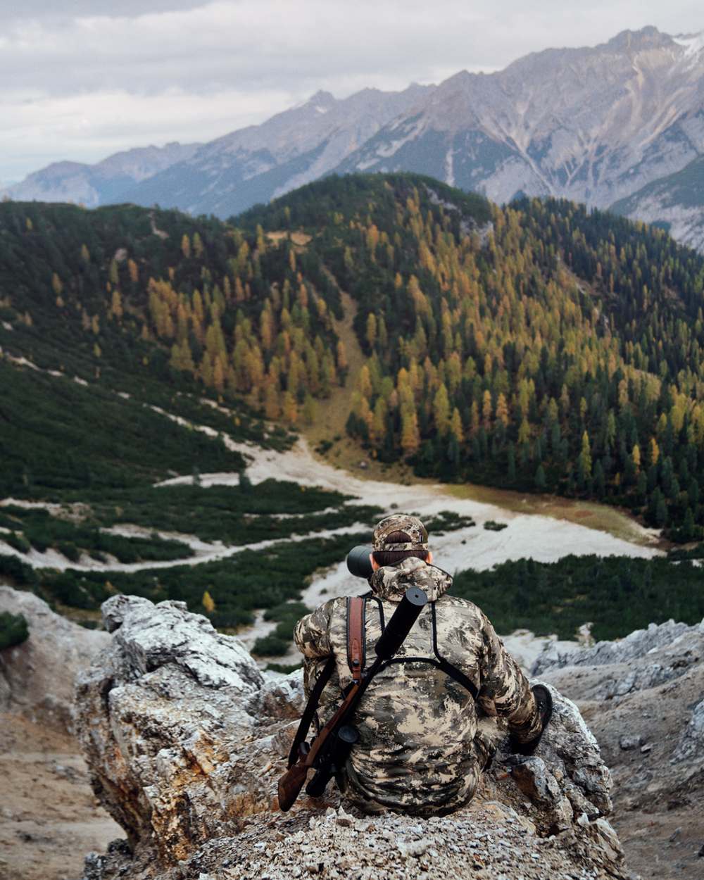 AXIS Mountain coloured Harkila Mountain Hunter Expedition Fleece Hoodie on mountain terrain background