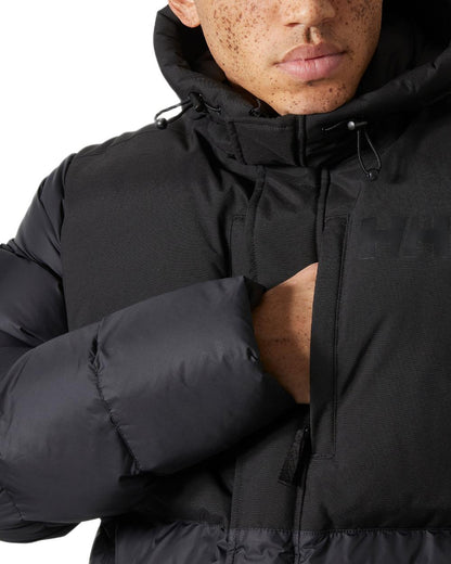 Black Coloured Helly Hansen Active Puffy Long Jacket on white background 