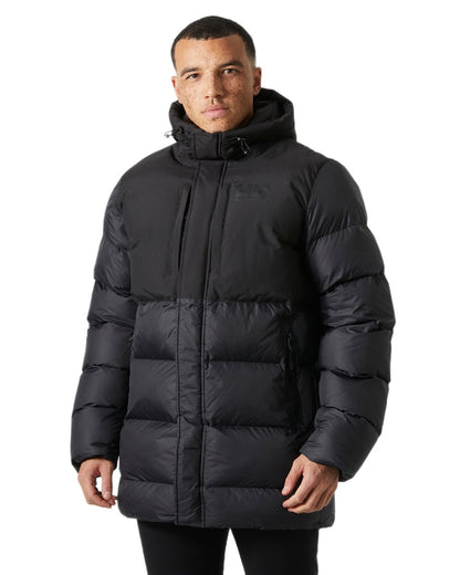 Black Coloured Helly Hansen Active Puffy Long Jacket on white background 