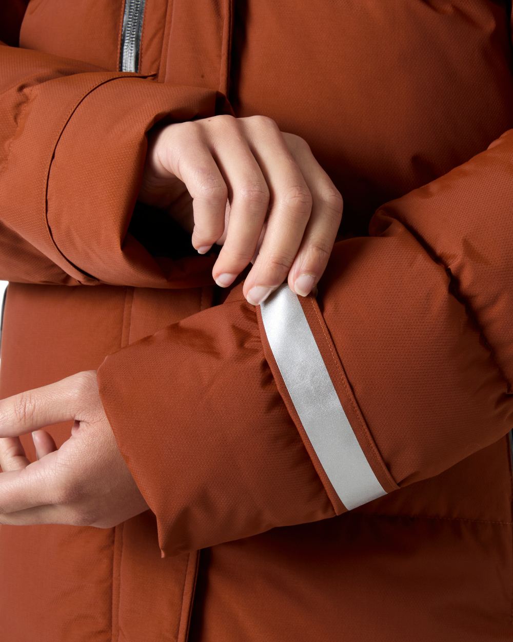 Iron Oxide Coloured Helly Hansen Adore Ladies Puffy Parka on white background 