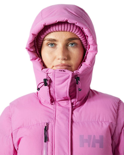 Meta Pink Coloured Helly Hansen Adore Ladies Puffy Parka on white background 