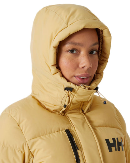 Sand Coloured Helly Hansen Adore Ladies Puffy Parka on white background 