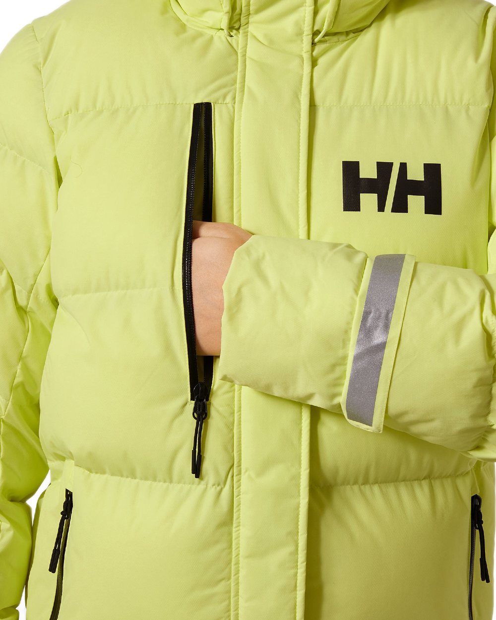 Sunny Lime Coloured Helly Hansen Adore Ladies Puffy Parka on white background 