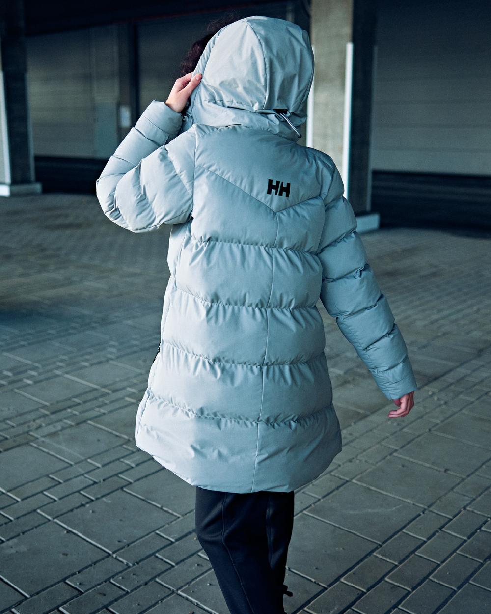 Baby Trooper coloured Helly Hansen Adore Ladies Puffy Parka on floor background 