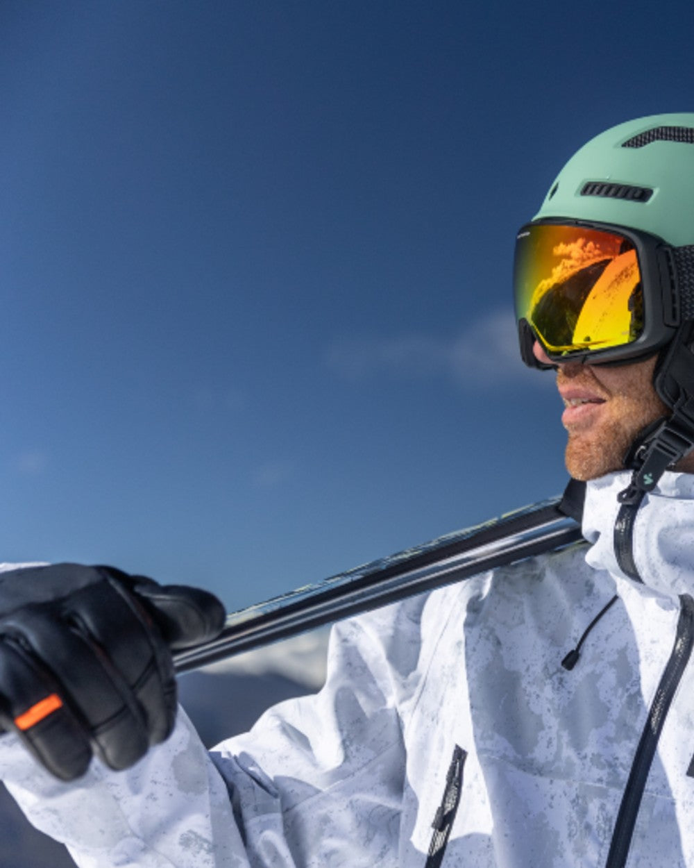 Black Coloured Helly Hansen All Mountain Gloves on snow background 