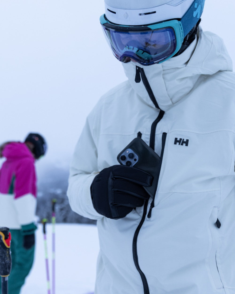Black Coloured Helly Hansen All Mountain Gloves on snow background 