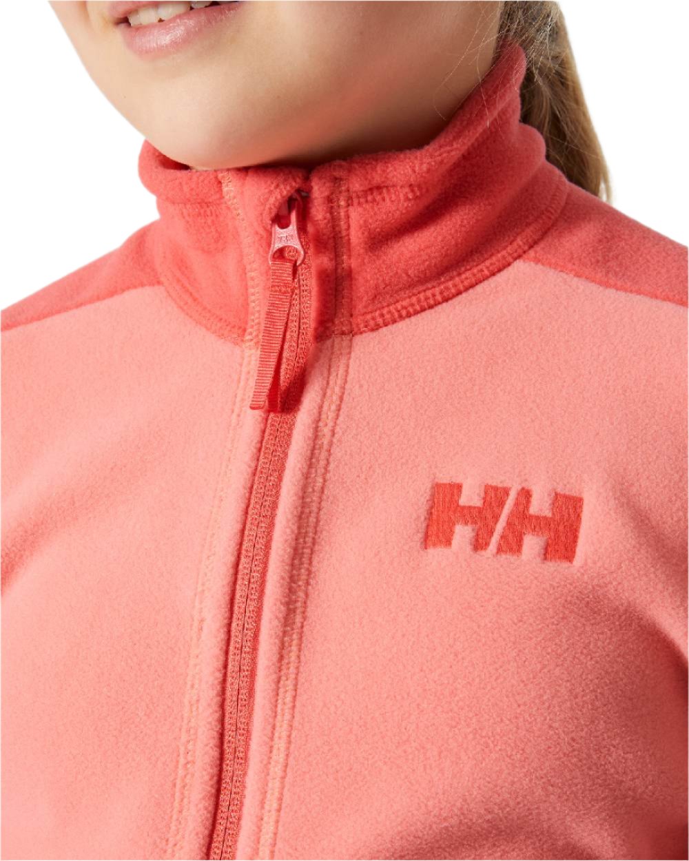 Coral Almond Coloured Helly Hansen Juniors Daybreaker 2.0 Jacket on white background 