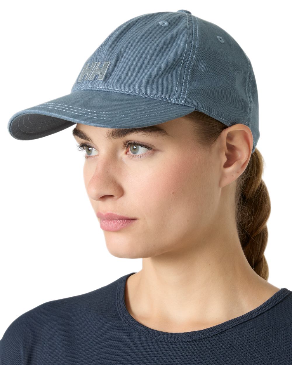 Washed Navy Coloured Helly Hansen Logo Cap on White Background
