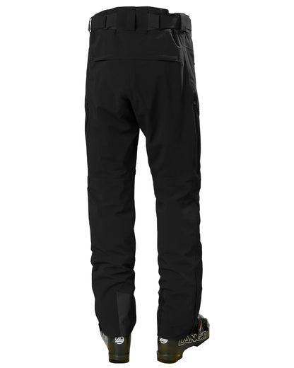 Black Coloured Helly Hansen Mens Alpha Lifaloft Insulated Ski Pants on white background 