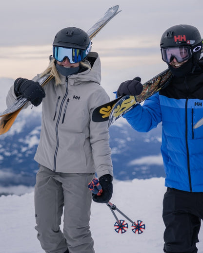 Concrete Coloured Helly Hansen Mens Alpha Lifaloft Insulated Ski Pants on snow background 