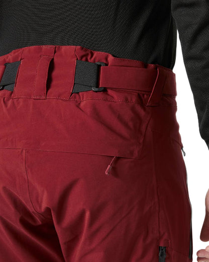 Mars Red Coloured Helly Hansen Mens Alpha Lifaloft Insulated Ski Pants on white background 