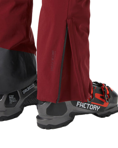 Mars Red Coloured Helly Hansen Mens Alpha Lifaloft Insulated Ski Pants on white background 