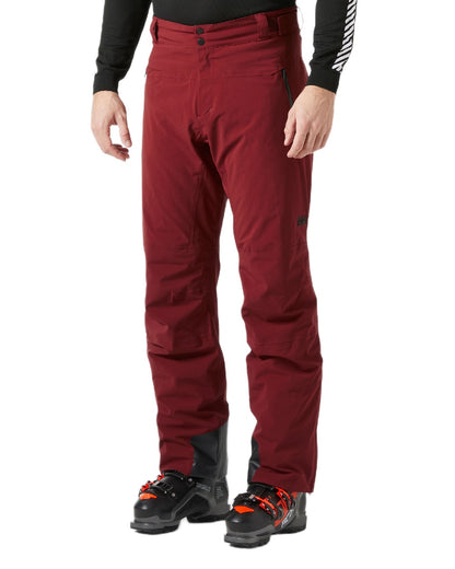 Mars Red Coloured Helly Hansen Mens Alpha Lifaloft Insulated Ski Pants on white background 