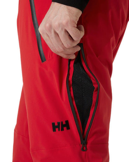 Red Coloured Helly Hansen Mens Alpha Lifaloft Insulated Ski Pants on white background 