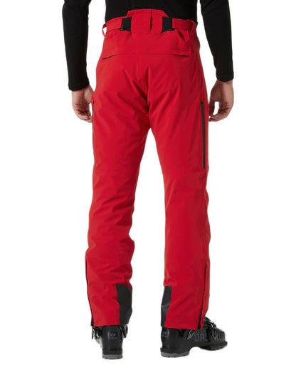 Red Coloured Helly Hansen Mens Alpha Lifaloft Insulated Ski Pants on white background 