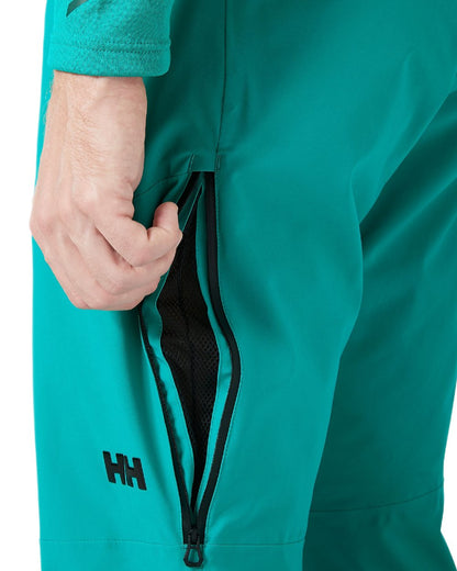 Signal Green Coloured Helly Hansen Mens Alpha Lifaloft Insulated Ski Pants on white background 