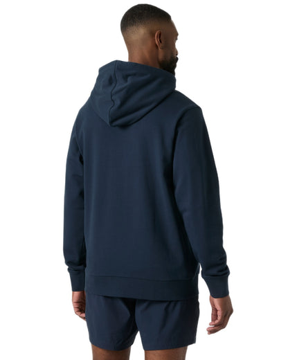 Navy coloured Helly Hansen Mens Core Graphic Hoodie on white background 