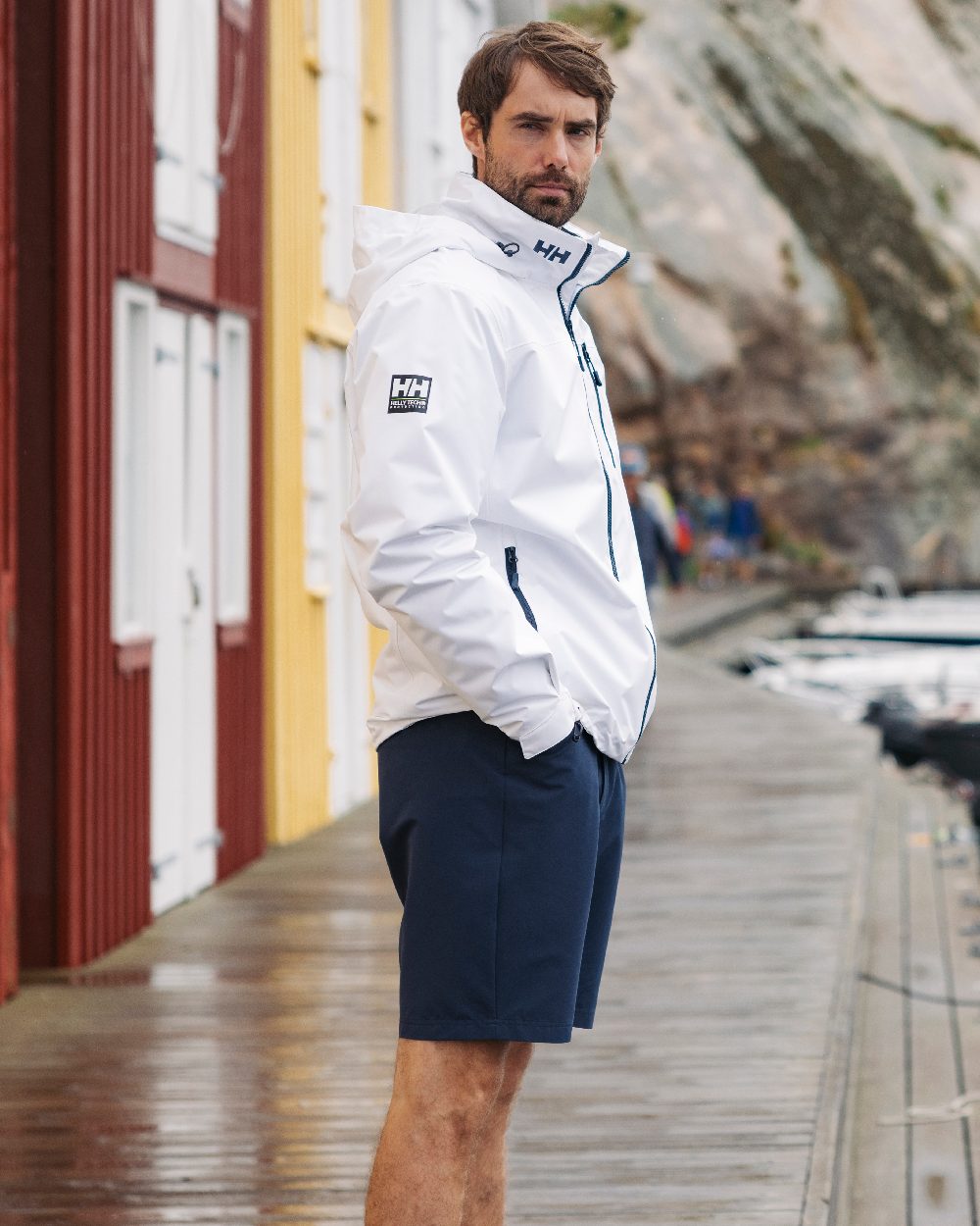 White Coloured Helly Hansen Mens Crew Hooded Jacket 2.0 on outdoor background 