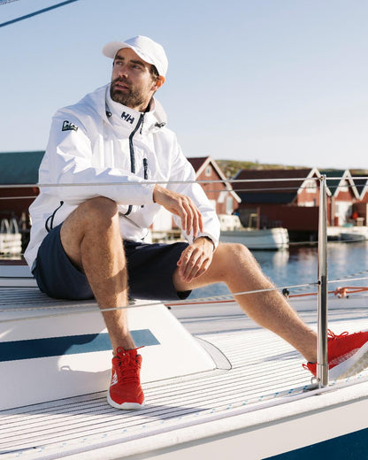 White Coloured Helly Hansen Mens Crew Hooded Jacket 2.0 on outdoor background 