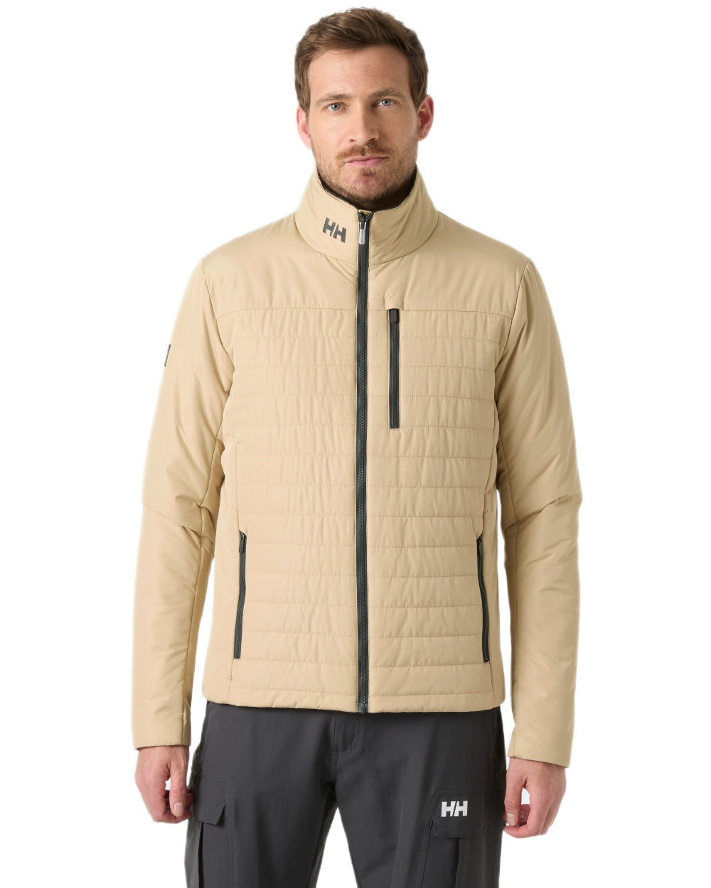 Khaki coloured Helly Hansen Mens Crew Insulated Sailing Jacket 2.0 on white background 