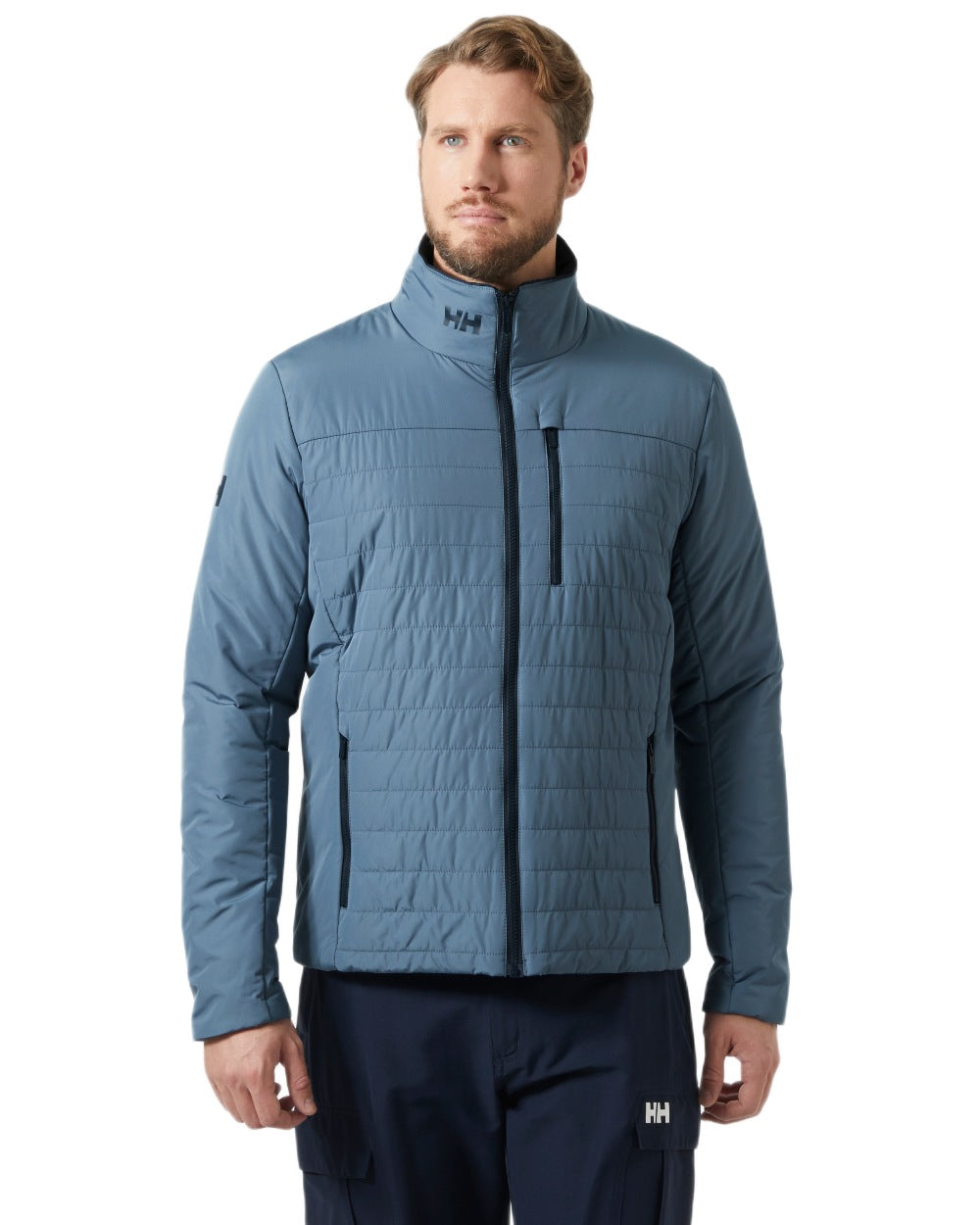 Washed Navy coloured Helly Hansen Mens Crew Insulated Sailing Jacket 2.0 on white background 