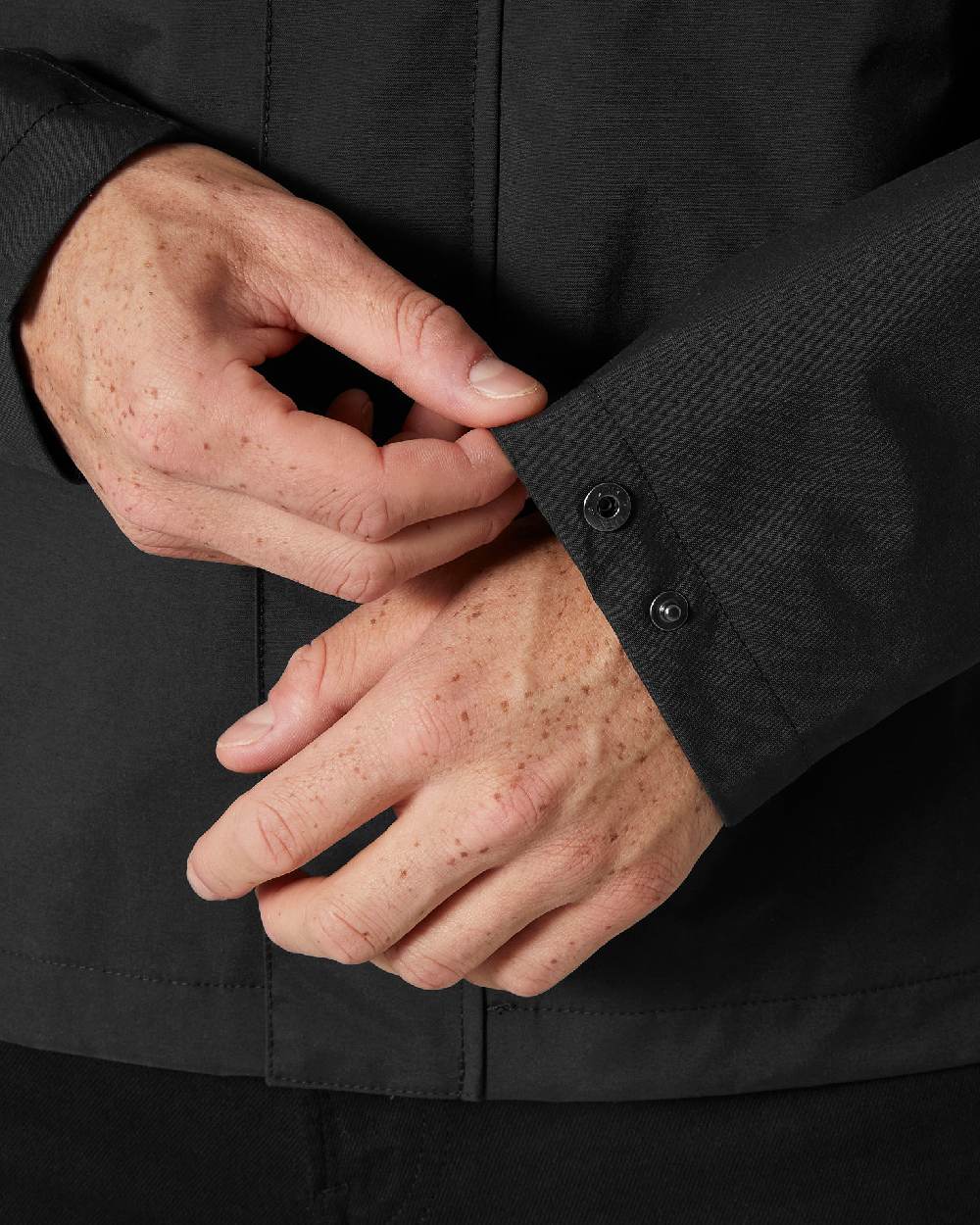 Black coloured Helly Hansen Mens Escape Rain Jacket on white background 