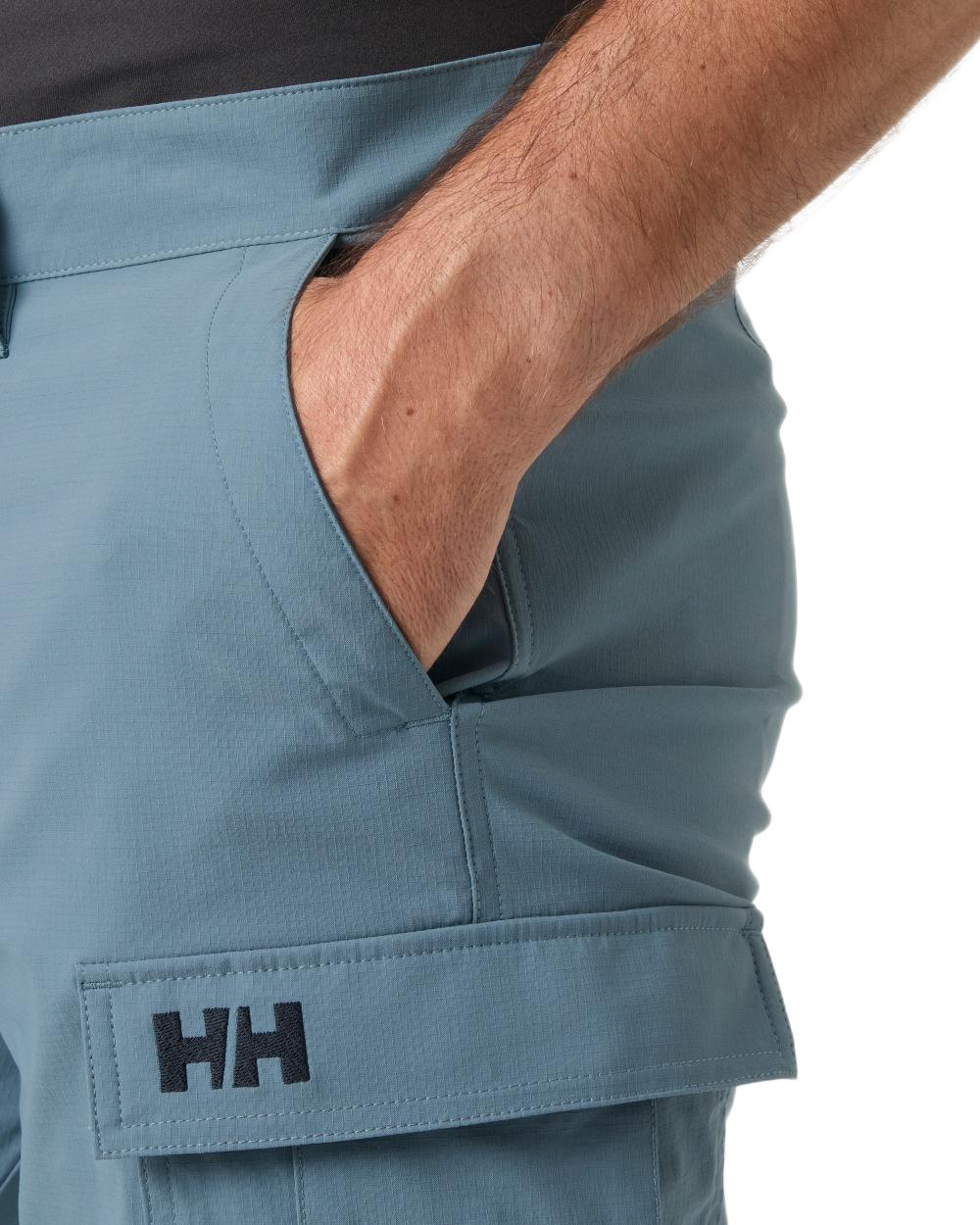 Washed Navy coloured Helly Hansen Mens Quick-Dry Cargo Shorts 11"on white background 