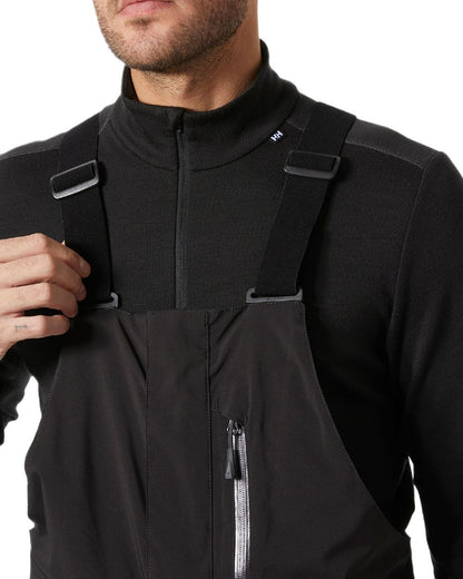 Black Coloured Helly Hansen Mens Legendary Insulated Bib Pants on white background 
