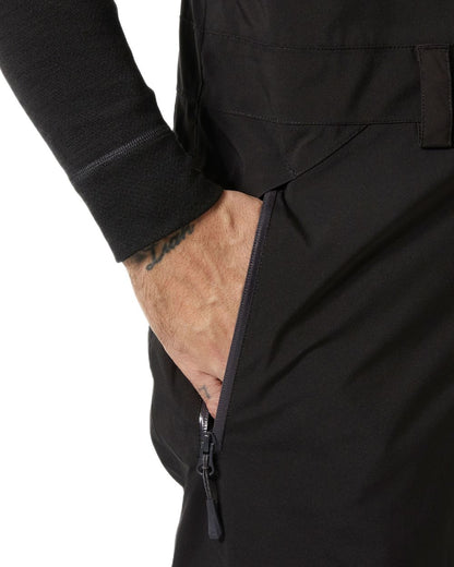 Black Coloured Helly Hansen Mens Legendary Insulated Bib Pants on white background 