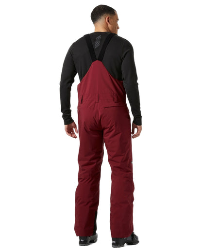 Mars Red Coloured Helly Hansen Mens Legendary Insulated Bib Pants on white background 