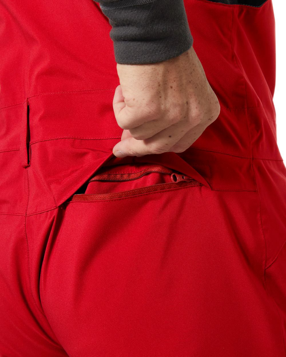 Red Coloured Helly Hansen Mens Legendary Insulated Bib Pants on white background 