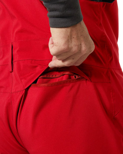 Red Coloured Helly Hansen Mens Legendary Insulated Bib Pants on white background 